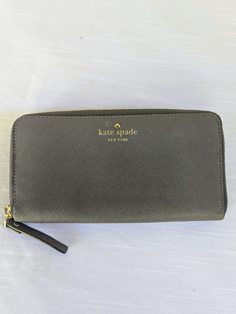 kate spade Gray zip-around saffiano wallet with gold logo